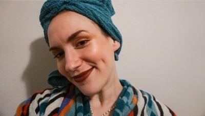 Woman wearing towel turban and bathrobe